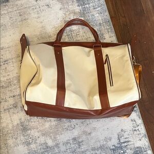 Tan Garment Bag with Brown Accents